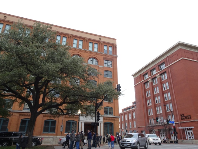 The former Texas State Book Depository. The sixth floor corner window, located directly below the top right window, is the location from where Lee Harvey Oswald fired shots, and allegedly killed JFK.